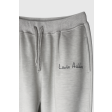 Жіночі брендовані штани-джогери з бежевого меланжевого трикотажу